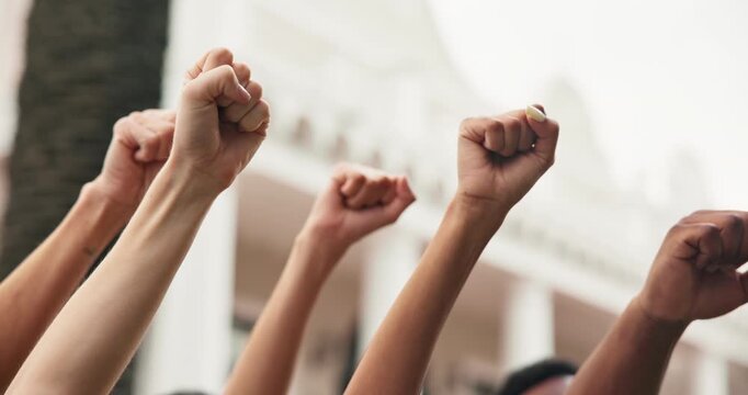 Hands, people and fist outdoor for protest, movement and call to action for violence awareness. Activist, community and rally resistance for humanitarian crisis, honoring victims and justice demand