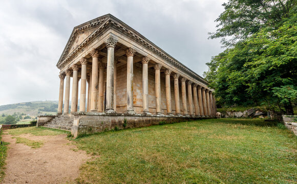 Perspective view of the church of Saint George, also known as the Parthenon de Las Fraguas, in Cantabria, Spain, on a cloudy summer day.