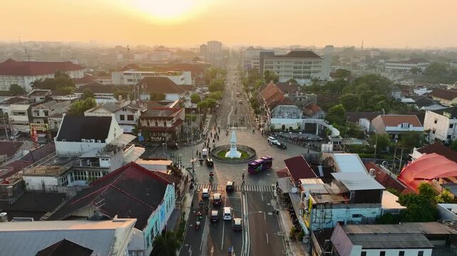 Sunset aerial cityscape overlooking iconic Tugu Jogja monument in Yogyakarta