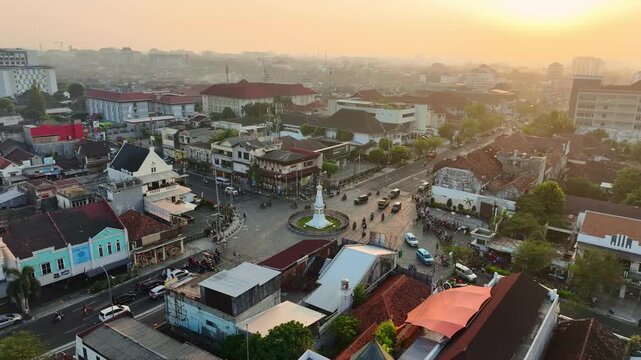 Sunset aerial view of Tugu Jogja surrounded by central Yogyakarta cityscape