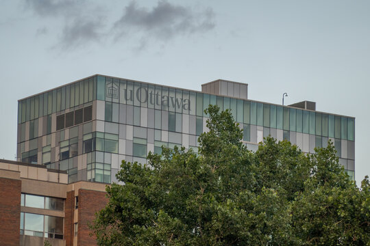 Ottawa, Ontario, Canada. September 18, 2026. Exterior view of the uOttawa university campus building with modern architecture and trees.