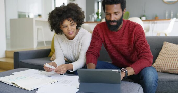 Documents, finance and tablet with black couple on sofa in home living room for investment planning. App, budget and papers with happy people in apartment together for review of financial portfolio