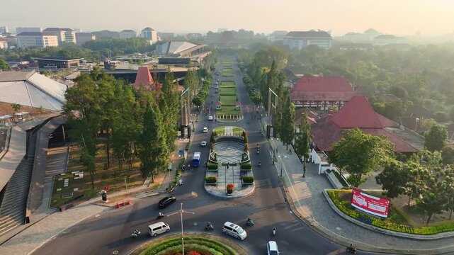 Aerial perspective over landscaped UGM Boulevard with urban traffic