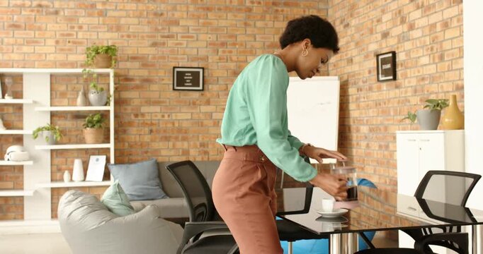 Lifestyle videos indoor of people doing activities at office, drinking coffee, woman standing in mod