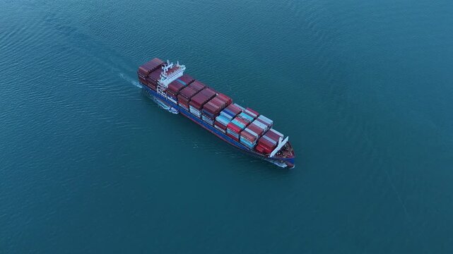 cargo ship carrying container and running for export goods from cargo yard port to custom ocean concept technology transportation. container ship export import shipping service.