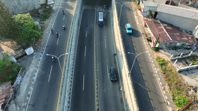 Aerial view of truck traveling along elevated urban flyover