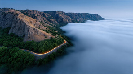 Obraz premium Winding mountain road, aerial view, high cliff, lush green forest, misty valley, sunrise, serene landscape