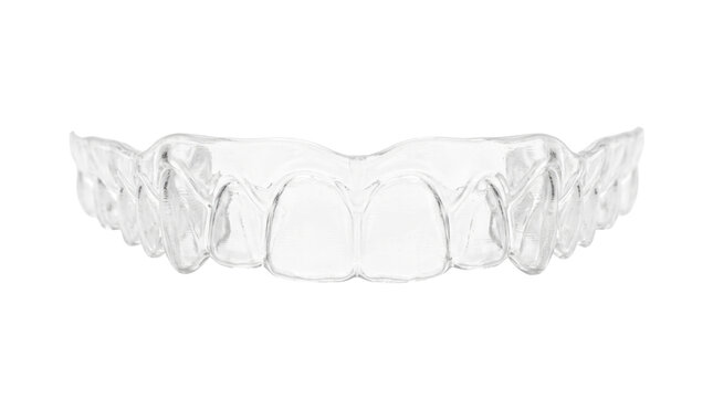 Clear dental aligner for orthodontic treatment, transparent plastic teeth retainer on white background, invisible braces for cosmetic dentistry