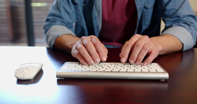 Lifestyle videos indoor of people doing activities at office, typing on keyboard, person working fro