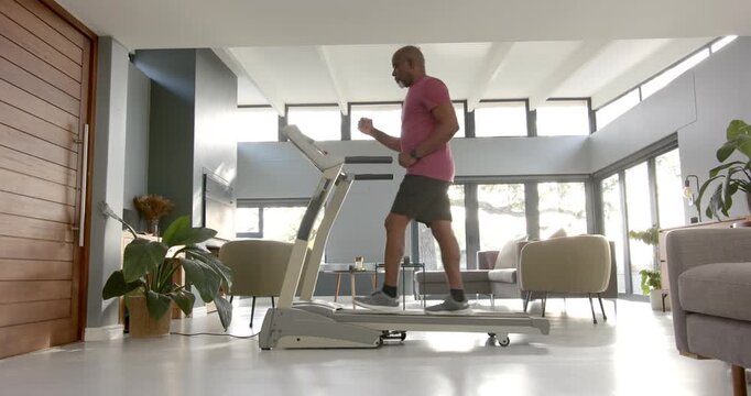 Lifestyle videos indoor of people doing activities at home, exercising on treadmill, man in living r