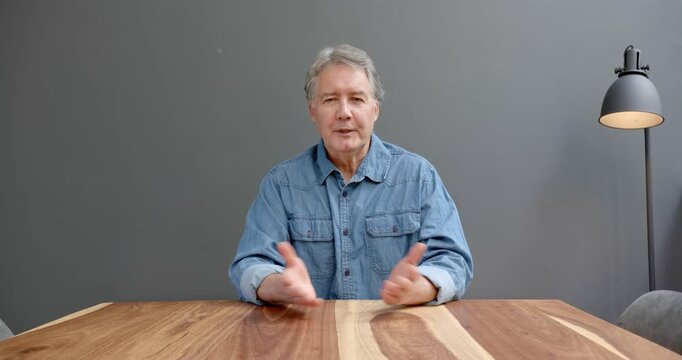 Close up of people talking to the camera, man in casual denim shirt talking and gesturing