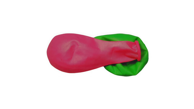 Bright pink and vibrant green rubber balloons isolated on a solid black background, studio shot of colorful party decorations for festive events isolated on a transparent background