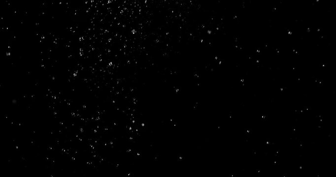 Realistic rain drops falling on a black background creating a natural weather VFX overlay ideal for compositing visual effects digital artwork atmospheric scenes and graphic design
