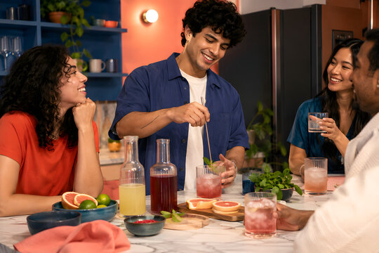 Friends enjoying alcohol free botanical drinks in a modern home