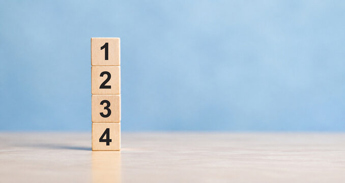 Task priority and management concept. The order of priority in any activity. Set work priority, arrange to do list. Wooden cube blocks with number first, second, third and fourth. 