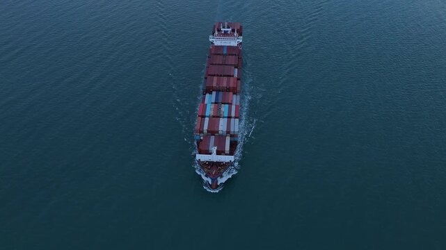 cargo ship carrying container and running for export goods from cargo yard port to custom ocean concept technology transportation. container ship export import shipping service.