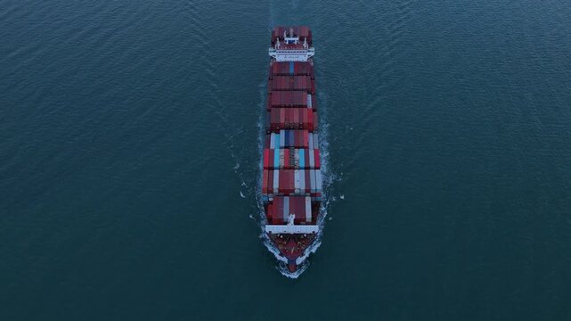 cargo ship carrying container and running for export goods from cargo yard port to custom ocean concept technology transportation. container ship export import shipping service.