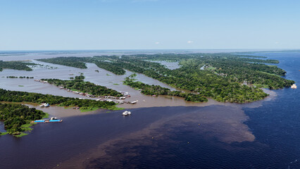 Obraz premium Amazon Meeting Of Waters At Manaus In Amazonas Brazil. Water From Solimoes River And Black River Form The Amazon River Known As Meeting Of Waters. Amazon Meeting Of Waters In Manaus Brazil.