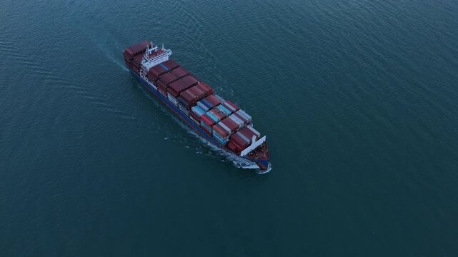 cargo ship carrying container and running for export goods from cargo yard port to custom ocean concept technology transportation. container ship export import shipping service.