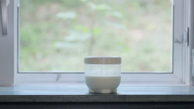 Yogurt fermentation container placed on a shelf
