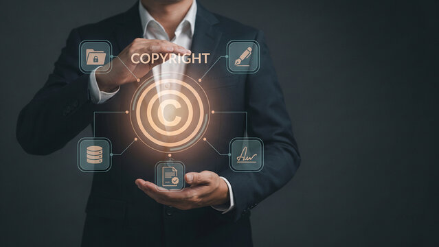 Executive man holding copyright text hologram with secure icons, digital copyright, patent protection, data security