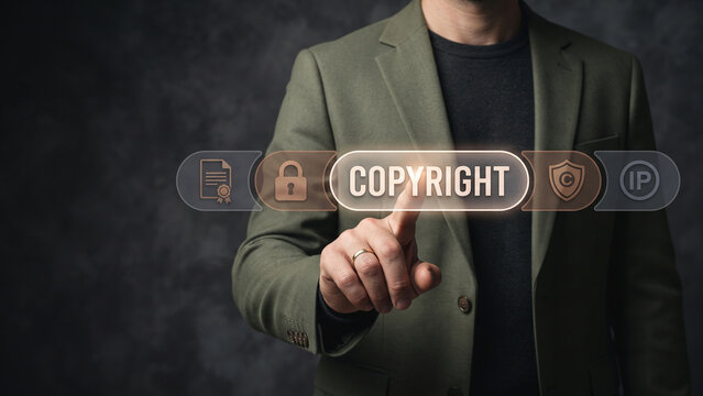 Businessman professional pointing at copyright text and icons interface, digital copyright, patent protection, rights management
