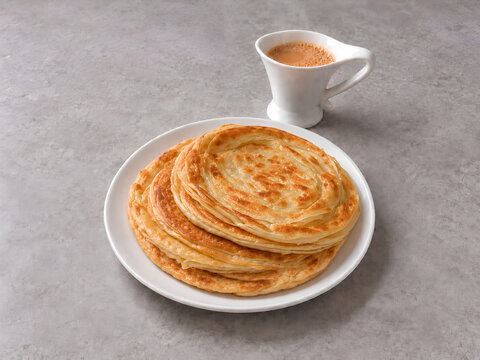 Golden Flaky Flatbread Served with Traditional Milk Tea