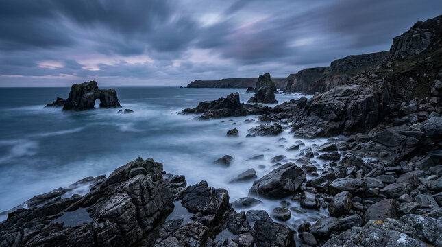 Rocky Coastline with Sea Arch at Twilight in Long Exposure
