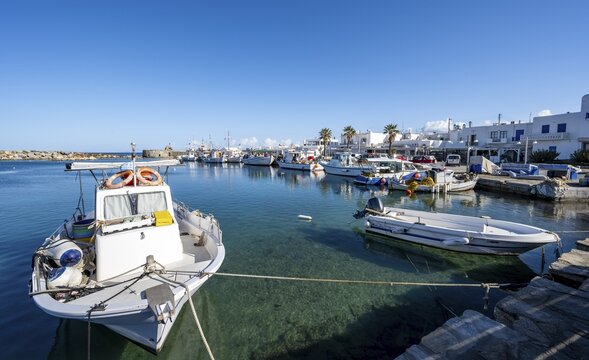 Fishing boats in Naoussa harbour, White Cycladic houses, Naoussa, Paros, Cyclades, Greece