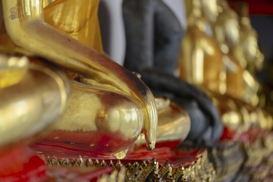 Gold-plated Buddha statues (Bhumispara-mudra: Gautama Buddha at the moment of enlightenment), Wat Pho, Bangkok, Thailand