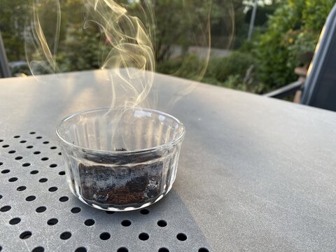 Coffee in a glass jar, on a table, lit, burning, smoking, to repel wasps, Stuttgart, Baden-W&uuml;rttemberg, Germany