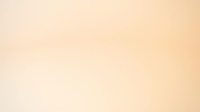 Minimalist beige background with soft gradient, abstract warm cream texture, elegant neutral aesthetic backdrop for product presentation