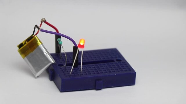 Red LED diode glowing when the power pin from battery is inserted onto the breadboard slots