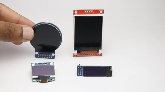 Picking up and placing various display modules on white background