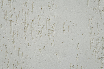 White textured wall surface creating abstract background © Iryna