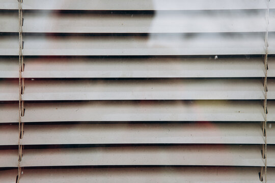 Venetian blinds creating a background texture with light