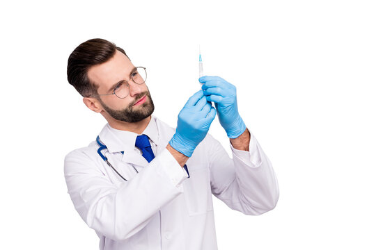 Close-up portrait of his he nice attractive smart clever focused experienced qualified bearded doc paramedic preparing prick drug pharmacy isolated on light white gray pastel color background