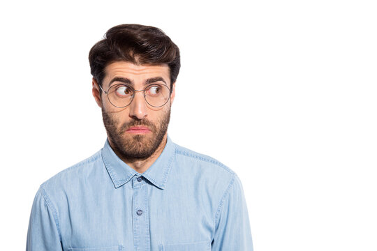 Photo of amazing indian guy looking side empty space feel guilty for awful situation wear specs casual denim shirt isolated white color background