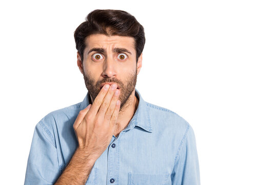 Close up photo of amazing multiethnic guy watching horror movie at cinema holding paln on opem mouth wear casual denim shirt isolated white color background