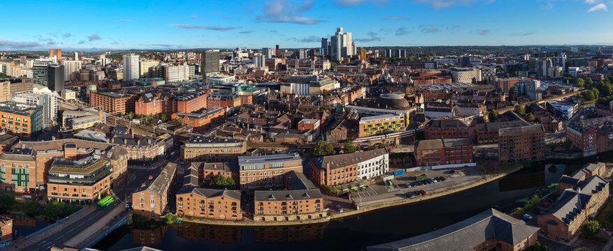 Aerial Panorama Over Leeds Bridge, River Aire, and City Skyline at Sunrise