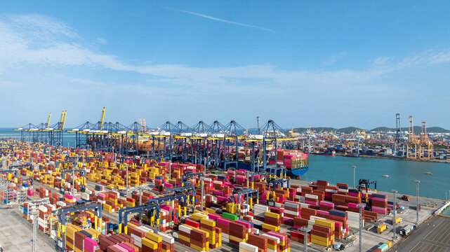Aerial view container cargo ship terminal, Loading and Unloading crane of container cargo ship terminal, Industrial port with containers and container ship.