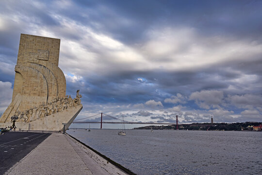 Padr&atilde;o dos Descobrimentos and 25 de Abril Bridge on Tagus River in Lisbon, Portugal