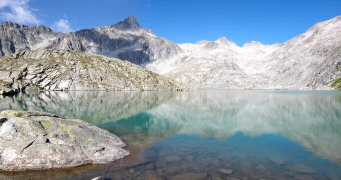 Relaxing landscape on the Dolomite lake of Vedretta