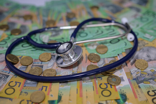 Stethoscope on Australian banknote in concept of Australia economy care, Health insurance and medical cost