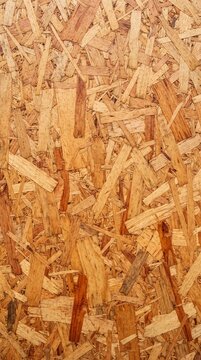 Raw wooden oriented strand board osb texture seamless full frame background of pressed wood flakes