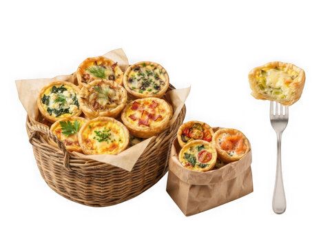 Small savory quiches in a rustic wicker basket and paper bag with a fork isolated on transparent background