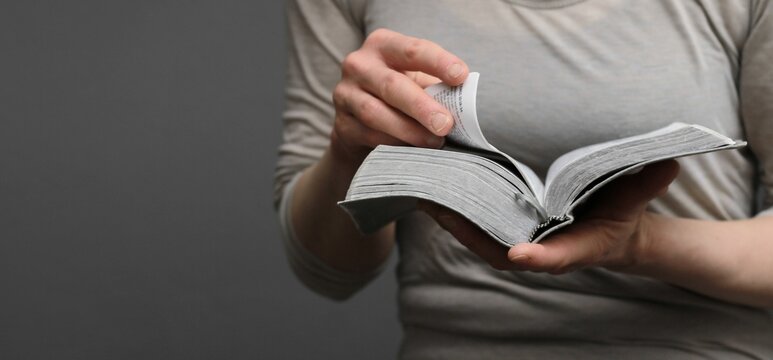 praying to god with hands on bible religious showing faith with God woman praying with background with people stock photo stock image