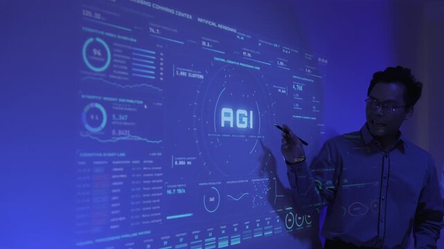 Asian engineer interacting with futuristic artificial intelligence dashboard interface projected on wall