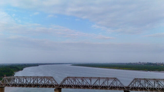 Bharuch Railway Bridge over Narmada River in Gujarat, India with Scenic River Landscape and Transportation Infrastructure