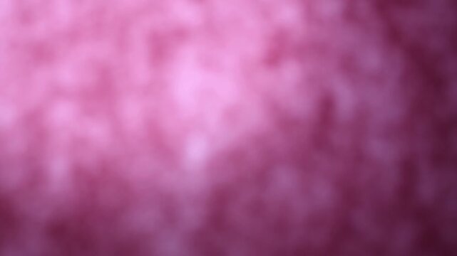 Una toma de cerca de un fondo abstracto de color violeta, morado y rosado con un degradado ligero desenfocado en movimiento